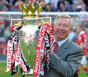 (FILES) In this file picture taken on May 22, 2011 Manchester United's Scottish manager Sir Alex Ferguson celebrates with the English Premier League trophy after their match against Blackpool at Old Trafford in Manchester, north west England. United celebrated winning the league for a 19th time beating Liverpool's long standing record. Alex Ferguson is to retire as the manager of Manchester United, the English Premier League champions announced on May 8, 2013. Ferguson, 71, has been in charge at Old Trafford for 26 years, guiding United to 13 Premier League titles and two Champions League crowns. AFP PHOTO/PAUL ELLIS FOR EDITORIAL USE ONLY Additional licence required for any commercial/promotional use or use on TV or internet (except identical online version of newspaper) of Premier League/Football League photos. Tel DataCo +44 207 2981656. Do not alter/modify photo.